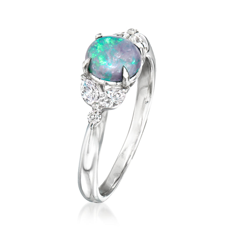 Platinum opal and diamond oval halo ring, side view with cathedral prongs