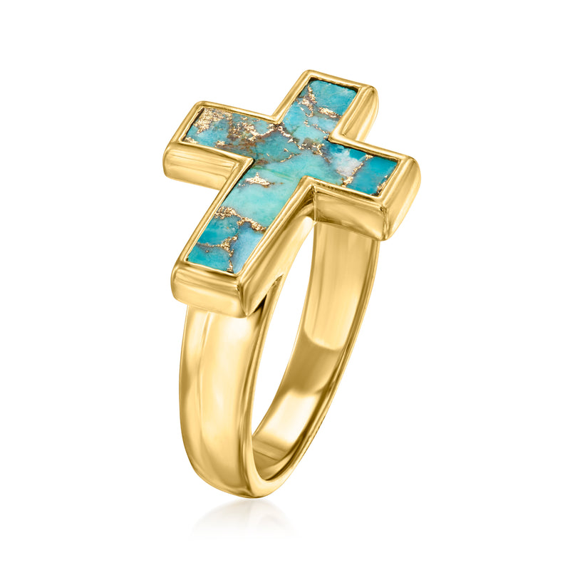 Turquoise cross ring in gold-toned setting with open-top bezel details.