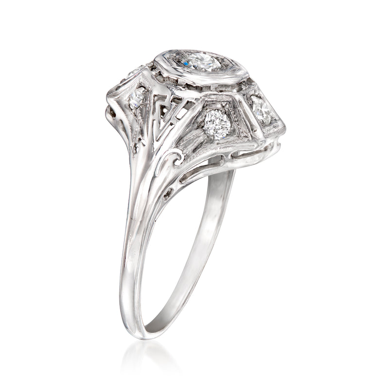 Vintage diamond ring in 18kt white gold with oval center stone and openwork setting