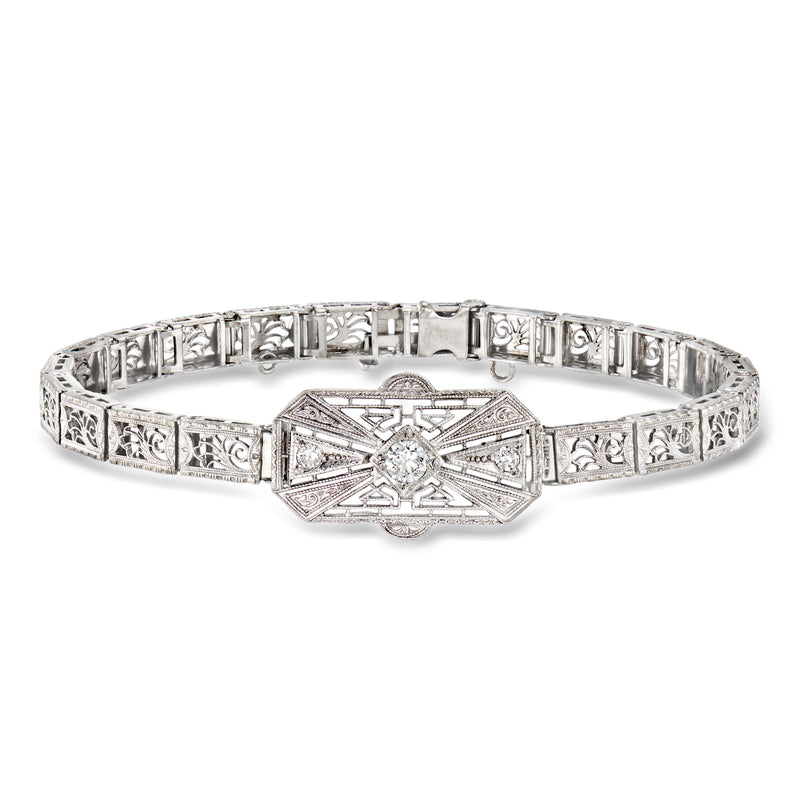 Vintage diamond openwork bracelet in white gold with platinum accents and central stone
