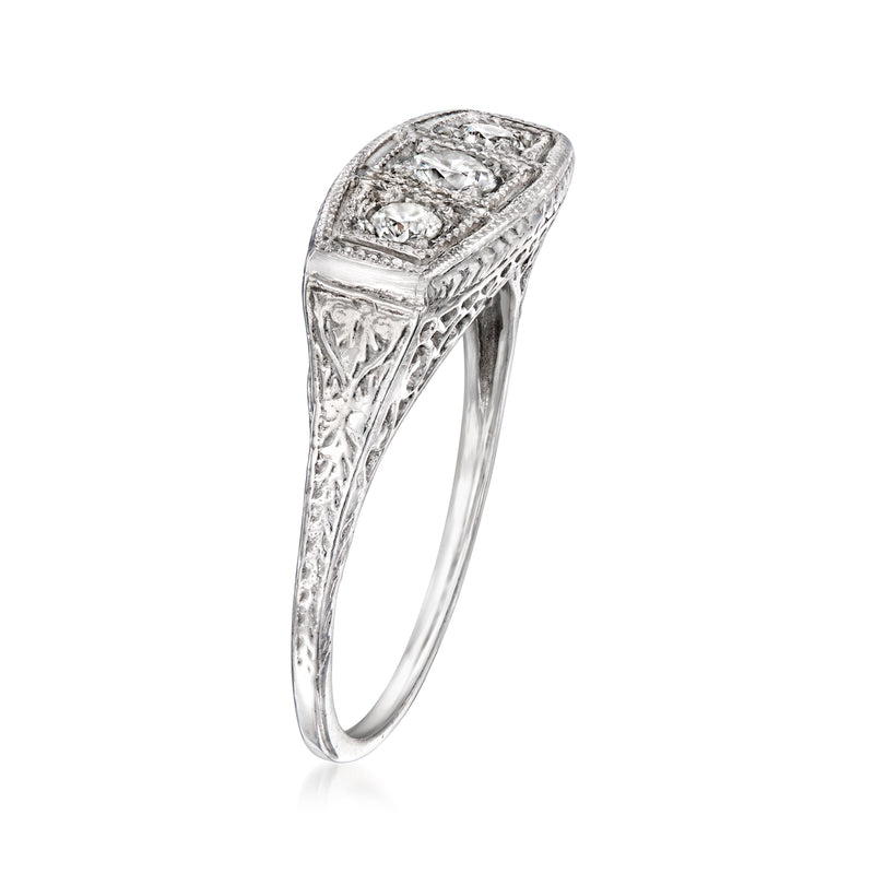 Vintage three-stone diamond ring in 14kt white gold, high-set top detail