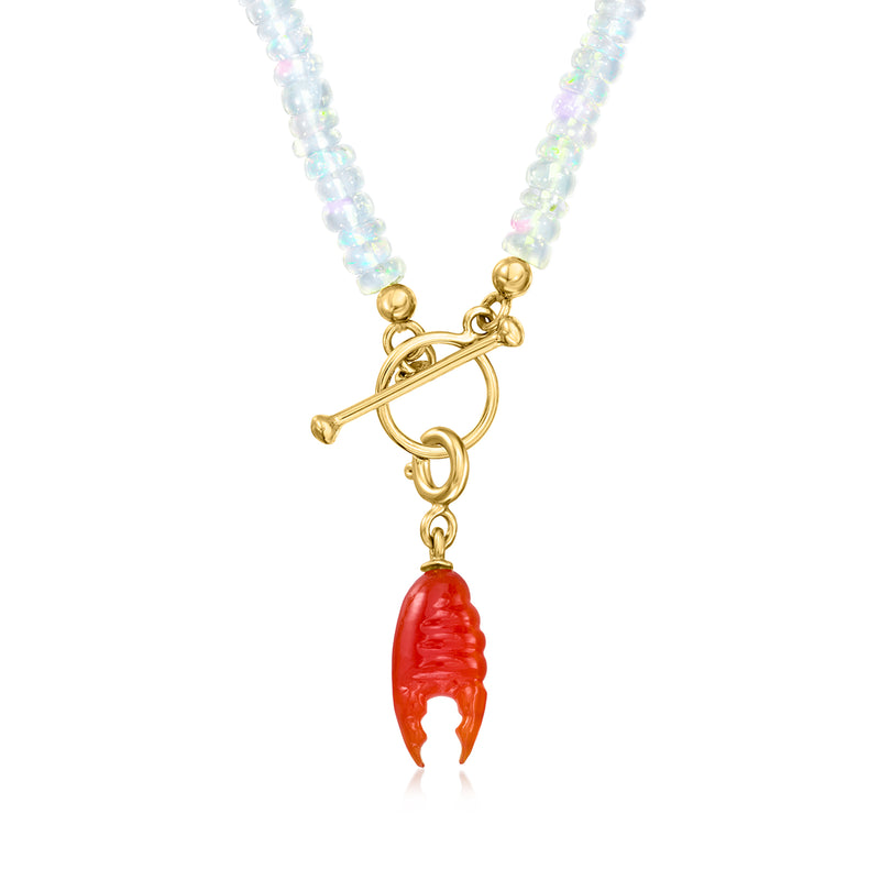 Lobster claw charm pendant in red carnelian with gold links and chain.