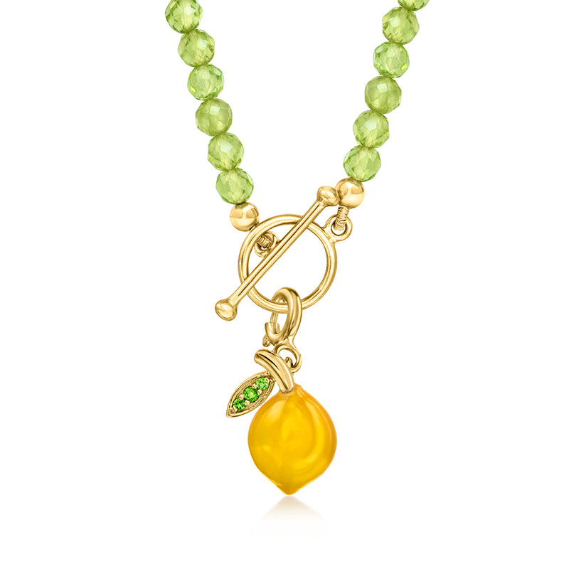 Yellow lemon charm dangle with green leaf detail on gold bead necklace