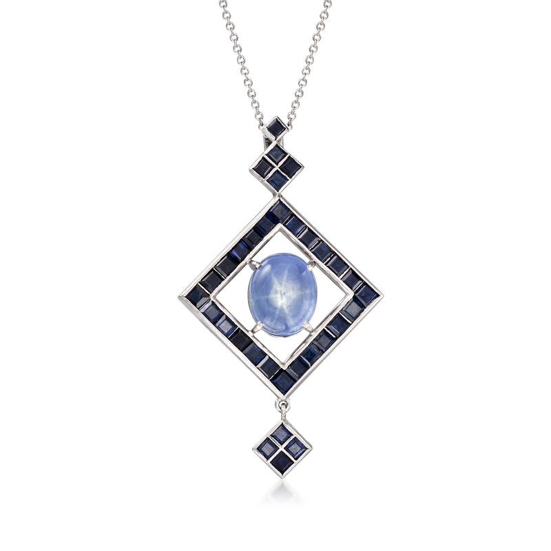 Platinum sapphire pendant necklace with light blue oval center and dark blue square accents