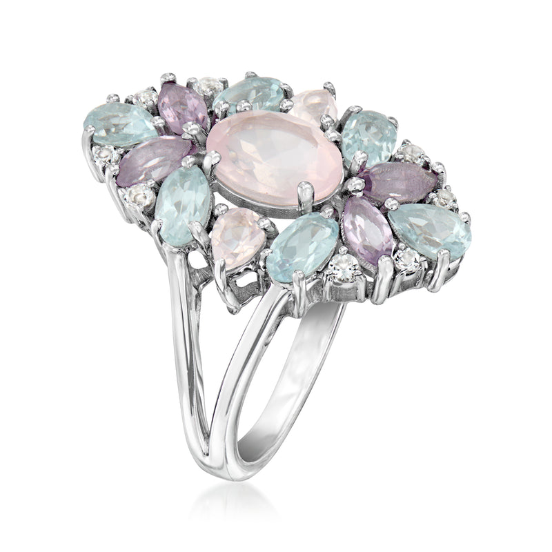 Sterling silver ring angled view with oval pink center and pastel multi-gem side stones