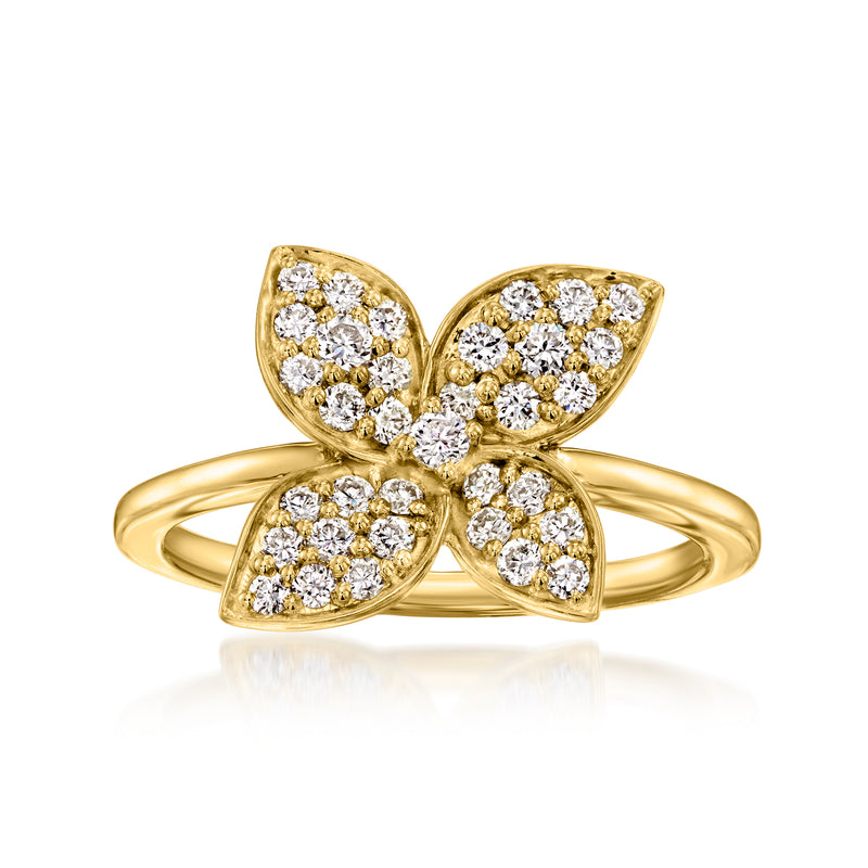 Gold flower diamond ring with four kite-shaped petals and a round center stone