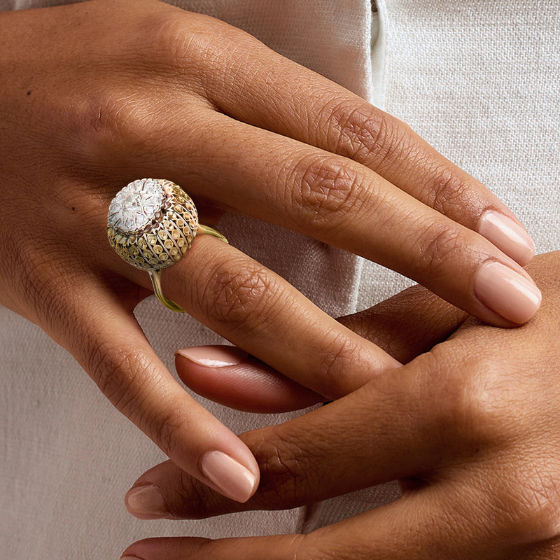 Vintage diamond ring on hand, yellow gold domed cluster with scalloped sides