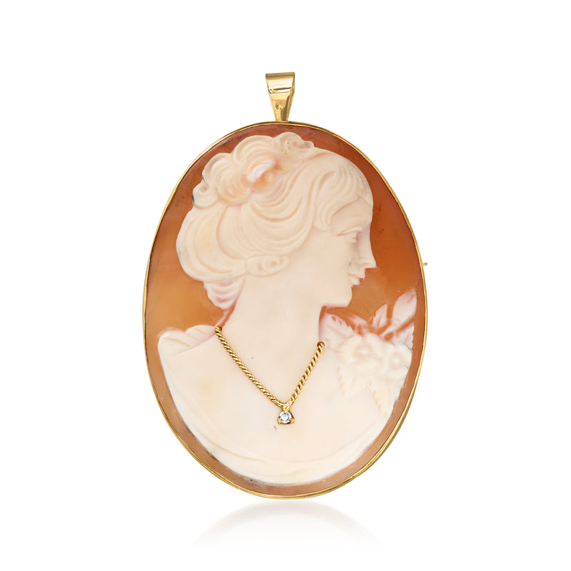 Oval brown shell cameo pendant, 14kt yellow gold frame, single diamond detail