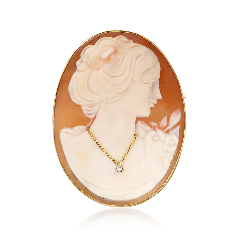 Oval brown shell cameo pendant, 14kt yellow gold bezel, single diamond at center