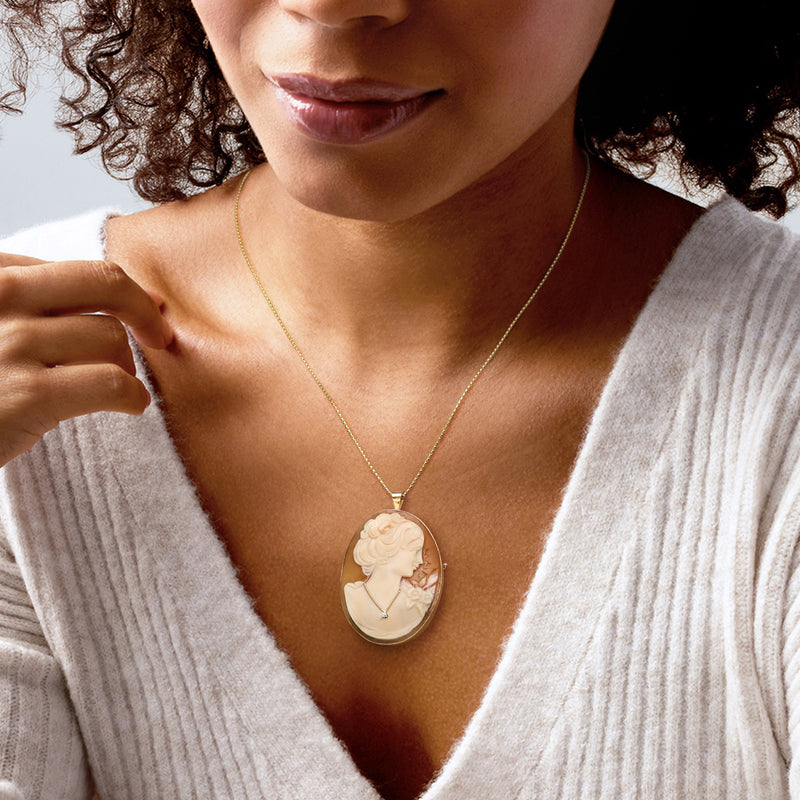 Brown shell cameo pendant on thin 14kt yellow gold chain, small diamond detail