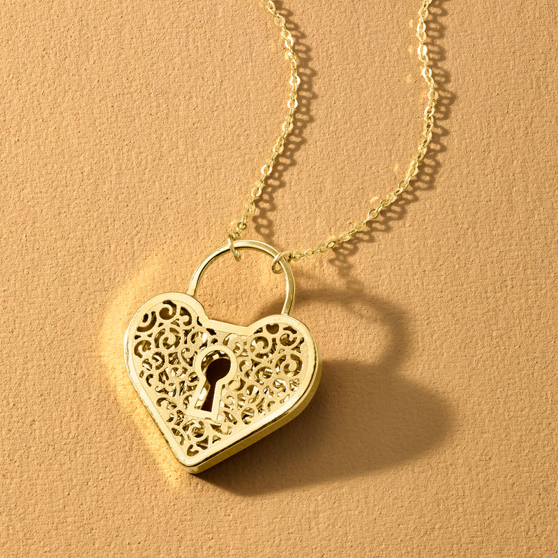 10kt yellow gold heart locket necklace, openwork filigree heart with keyhole