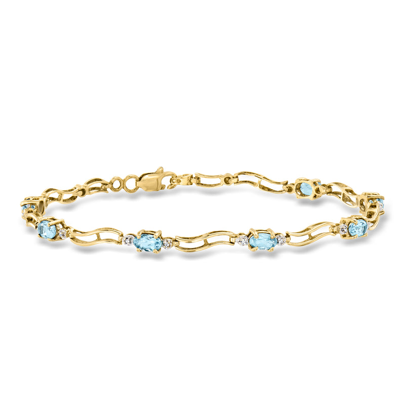 Yellow gold link bracelet with light blue gemstones and small diamond accents