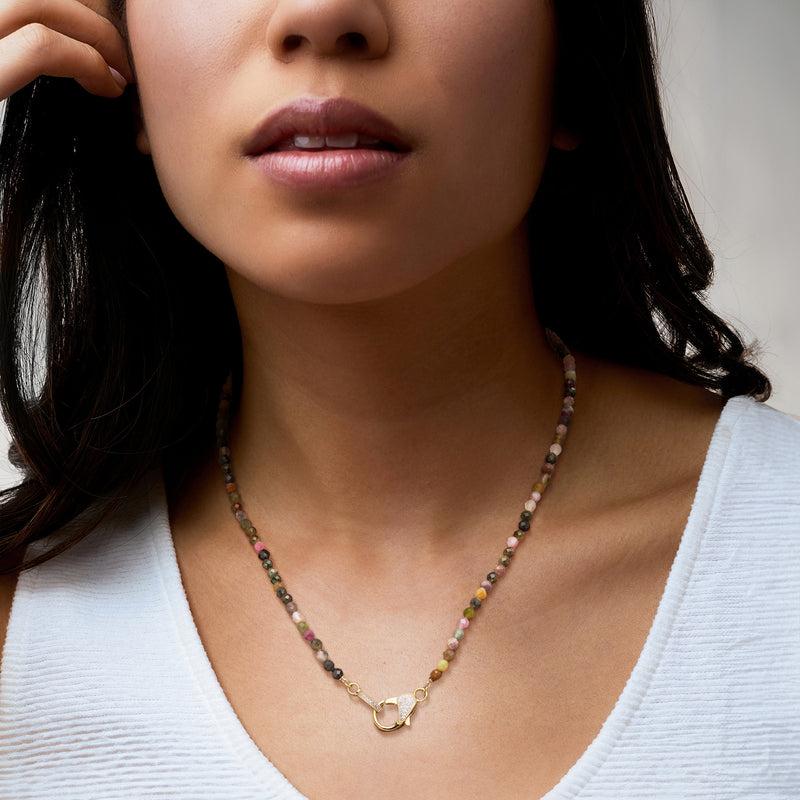 Gold multicolored tourmaline bead necklace on model with lobster clasp connector at neckline