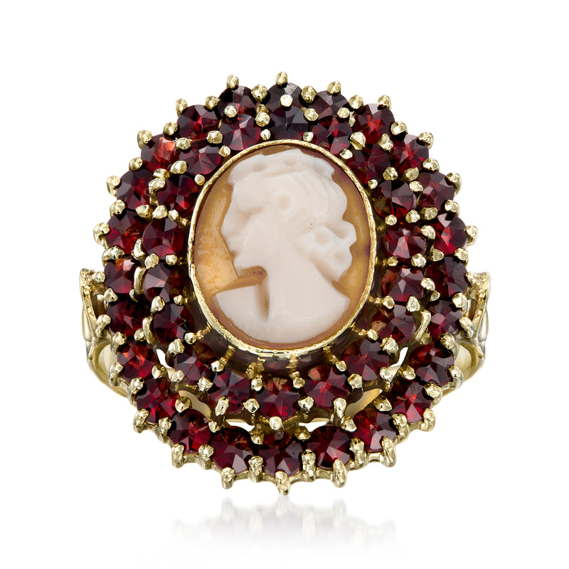 Oval cameo ring in 14kt yellow gold with garnet halo and beaded accents