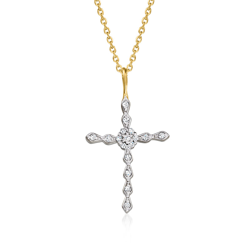 Gold-tone cross pendant necklace with diamond-like stone settings on a delicate chain.