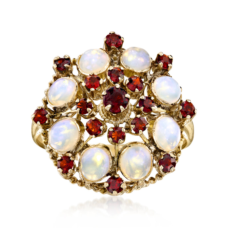 Yellow gold cluster ring with white opal stones and red ruby accents