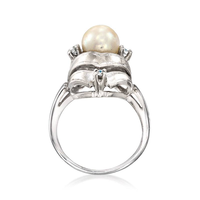 White gold ring view from side, round cultured pearl center with diamond accents