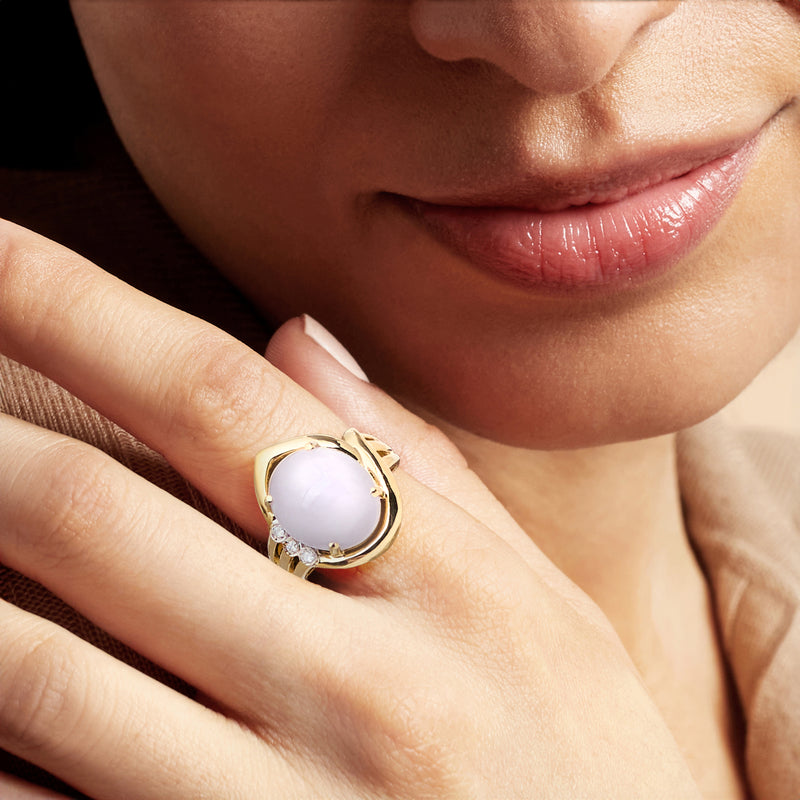 Oval lavender jade ring in 14kt yellow gold with small diamond halo