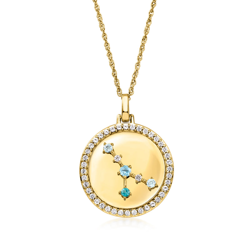 Gold tone zodiac constellation pendant necklace with blue and clear stones inside round frame