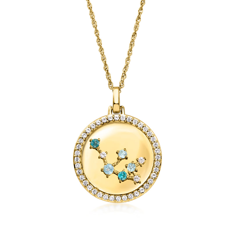 Gold tone zodiac constellation pendant necklace with mixed blue and clear stones on gold disc