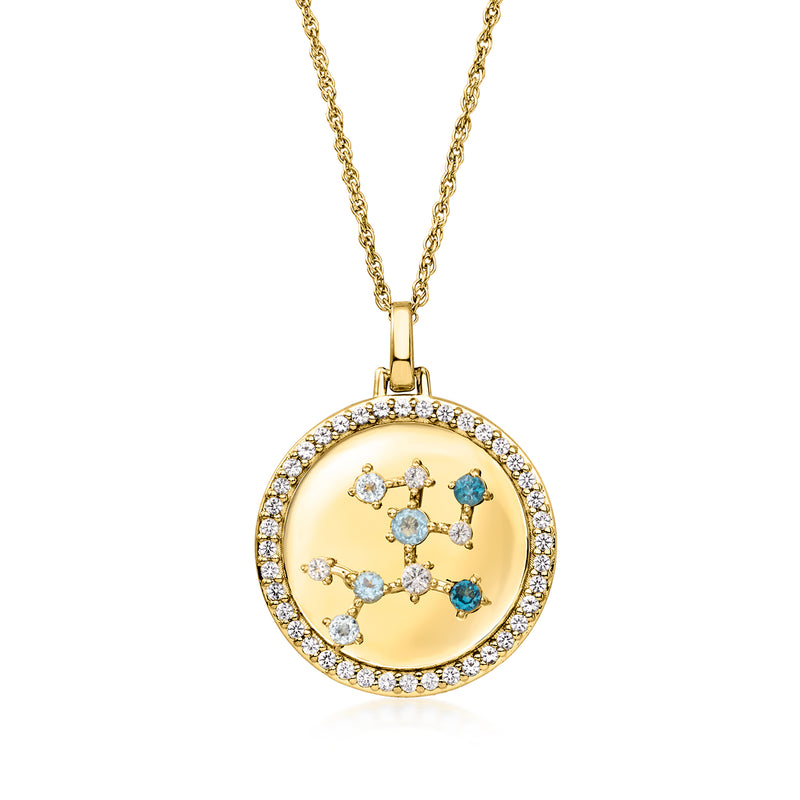 Gold tone zodiac constellation pendant necklace with blue and clear stones in round halo