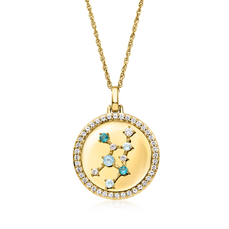 Gold zodiac pendant necklace with round halo and blue, light stones