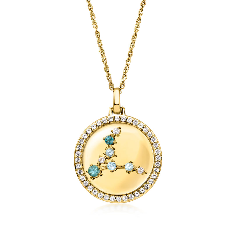 Gold zodiac pendant necklace, round bezel with blue and clear stones