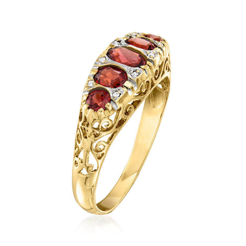 Side view vintage 14kt yellow gold ring with five red garnets and diamond trim
