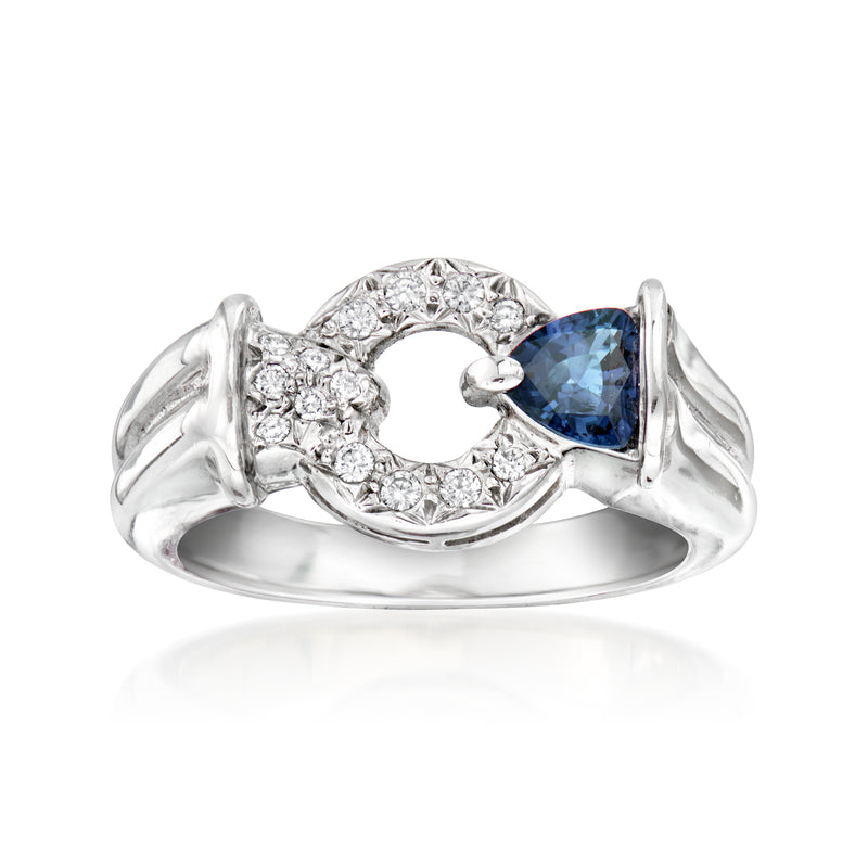 Platinum sapphire and diamond circle ring with split shoulders and blue center stone