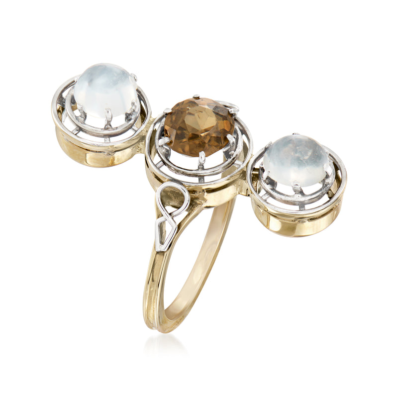 Vintage gemstone ring in platinum and yellow gold, side view of three bezel-set stones