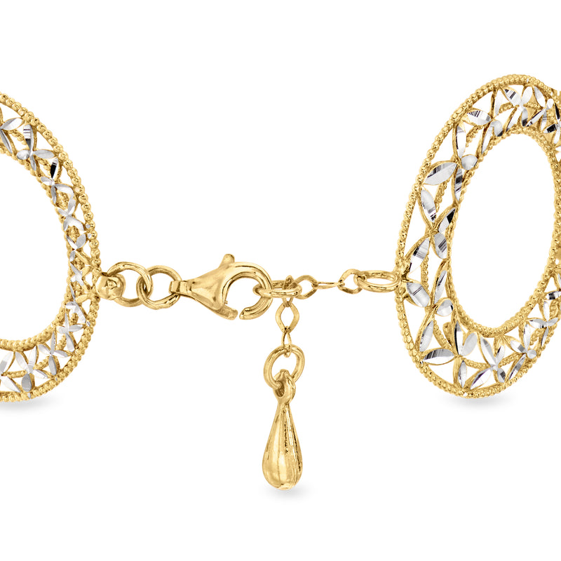 Two-tone gold circle bracelet with openwork links, chain clasp, and teardrop charm