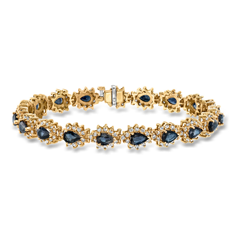 Yellow gold tennis bracelet with blue sapphire clusters and white diamond accents