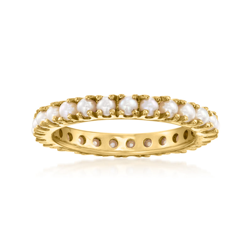 Gold eternity band ring with round white pearls and scalloped bezel links