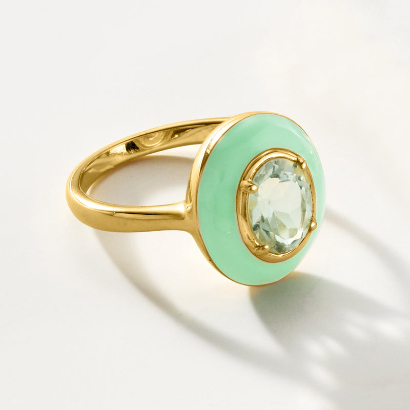 Gold ring with pastel green enamel oval frame and oval light green gemstone