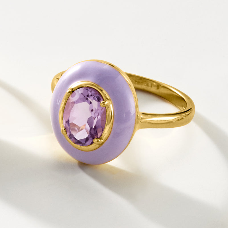 Gold band ring with lavender enamel oval setting and oval amethyst-like gemstone