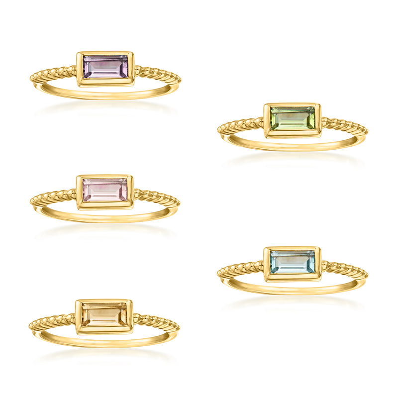 Gold-tone five-ring set with rectangular gemstones in purple, green, and blue tones