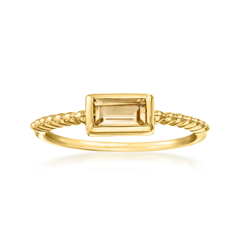 Gold-tone ring with rectangular golden gemstone and twisted split-shank