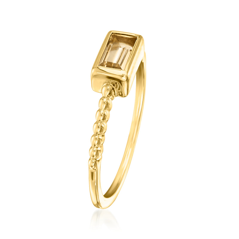 Gold-tone ring with rectangular gemstone and chain link detail