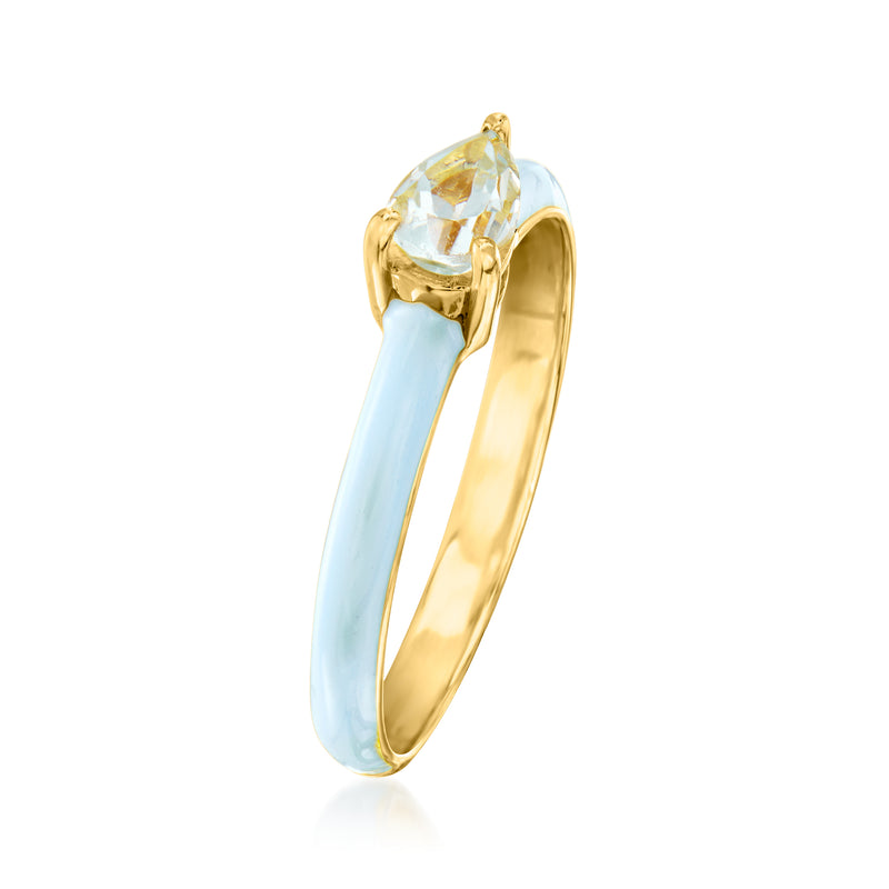 Gold ring with oval faceted aquamarine-like stone and light blue enamel detail