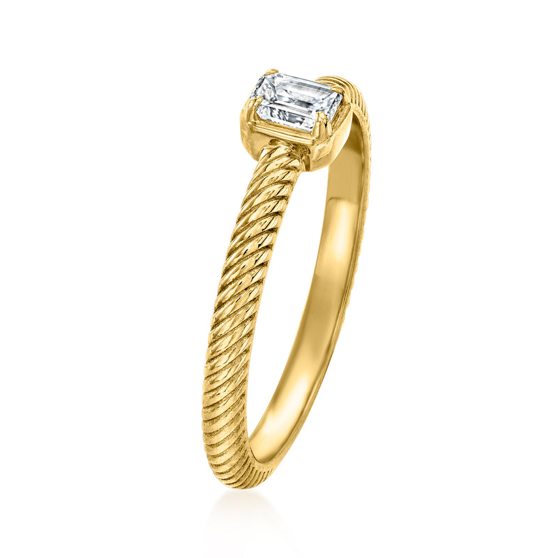 Twisted gold ring with an emerald-cut diamond, side view of the twisted band
