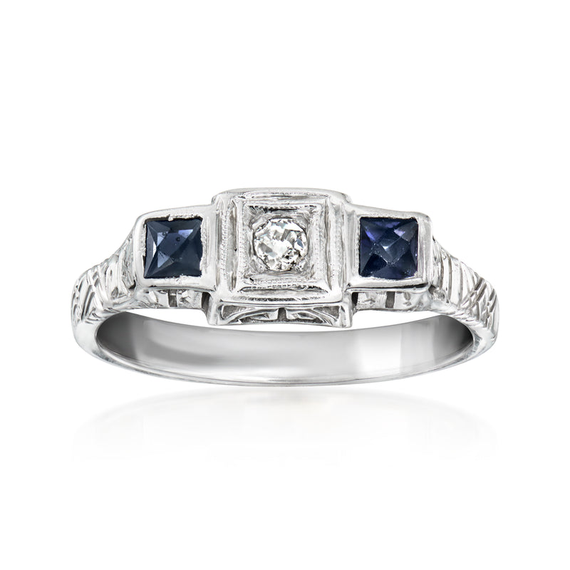 Vintage white gold ring with dark blue sapphire square stones and a center diamond