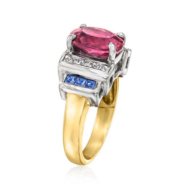 Pink oval gemstone ring with diamond band and blue sapphire channel-set sides