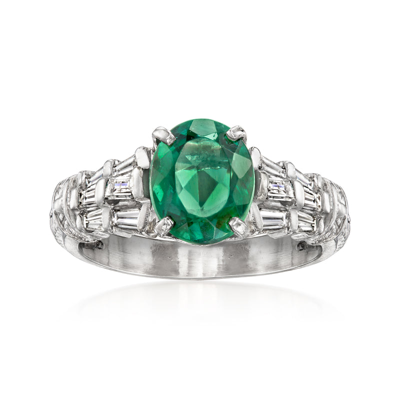 Platinum vintage ring with oval green tourmaline center and baguette diamond accents