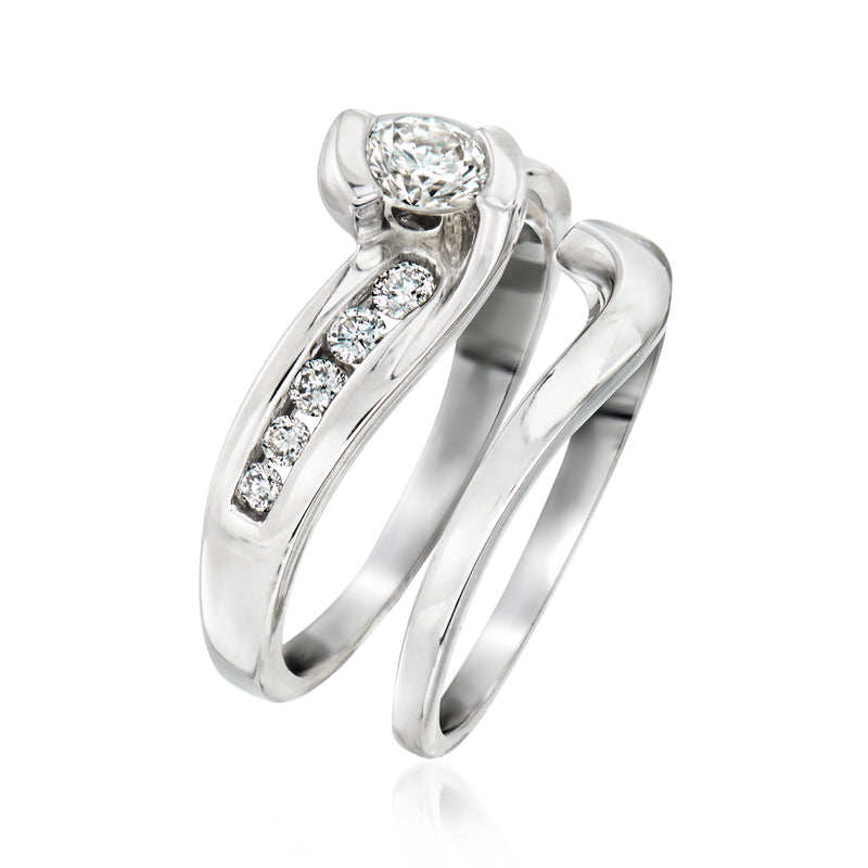 14kt white gold diamond engagement ring with round center and small side diamonds