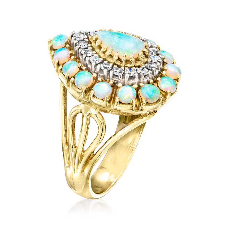 Yellow gold opal pear-shaped cluster ring with diamond accents and round opal sides