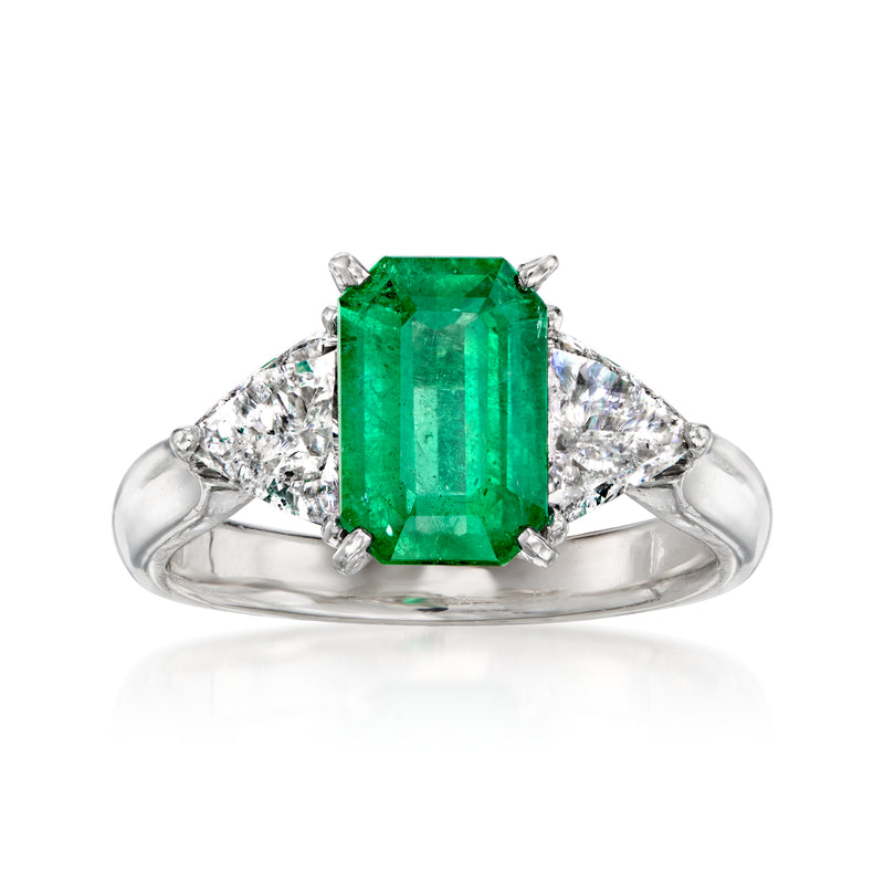 Platinum ring with square emerald center stone and tapered diamond side stones