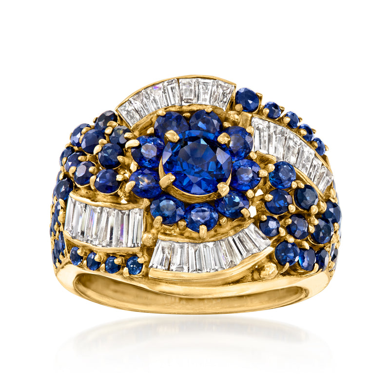 18kt yellow gold ring with oval blue sapphire center, diamond and blue stone halo