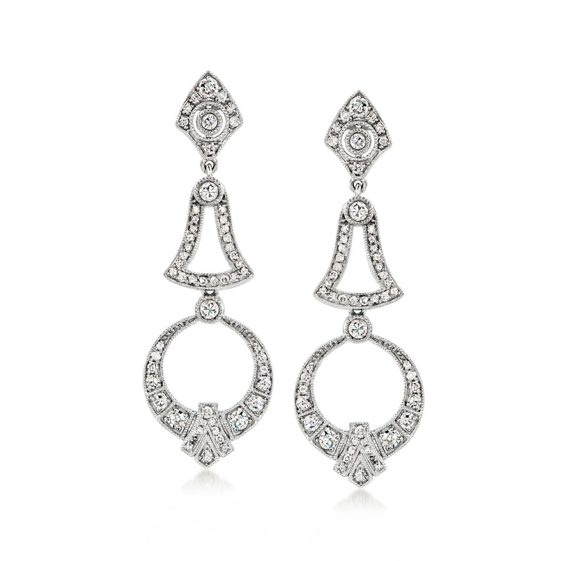 White gold diamond drop earrings with geometric tops and hoop-and-bell dangles