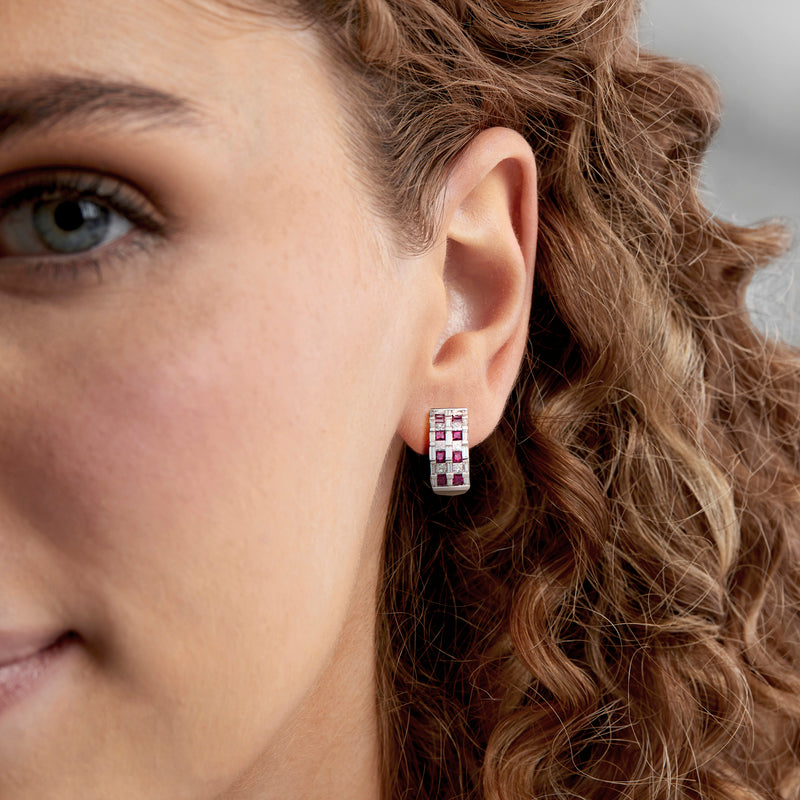 Ruby and diamond curved rectangle earrings on ear, 18k white gold checkerboard