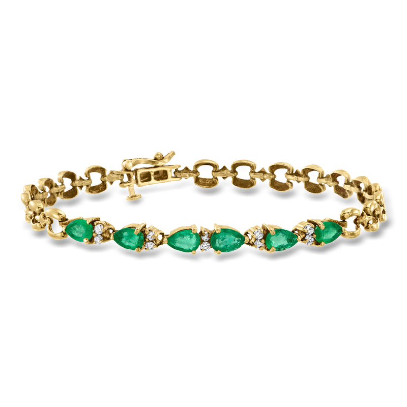 Vintage yellow gold bracelet with oval emerald green stones and small diamond accents